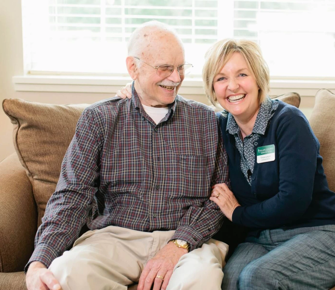 staff sitting with resident