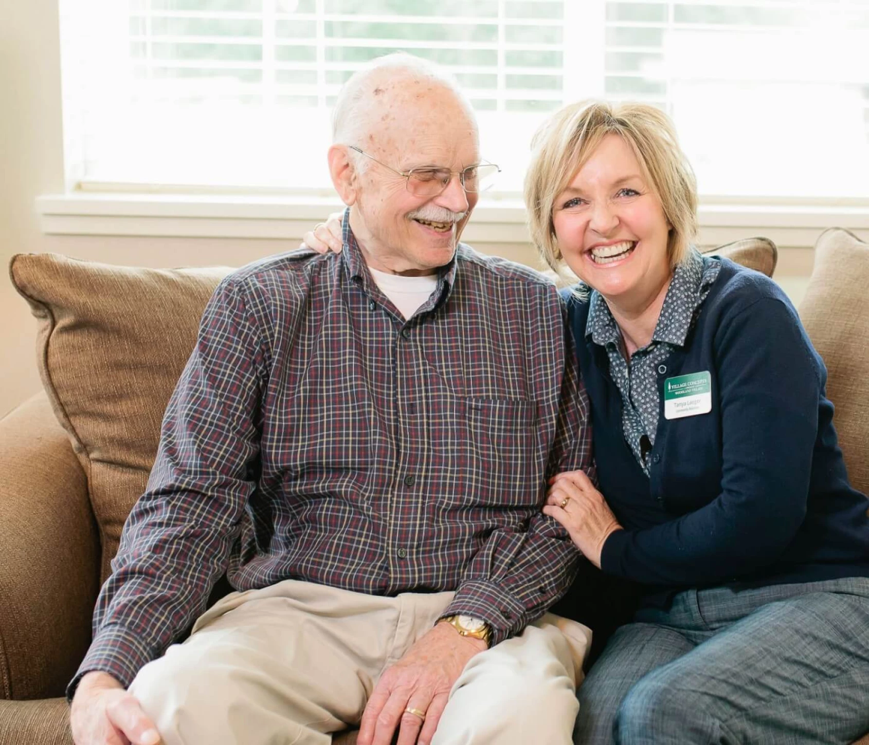 staff sitting with resident